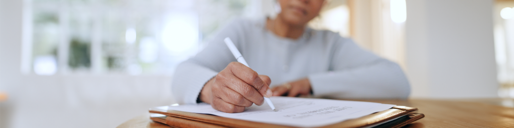 Women signing her will